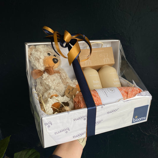 A gift box made up of quality baby products. The perfect new baby hamper