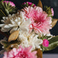 A close up on seasonal flowers, chrysanthemums, gerberas and asters with magnolia foliage
