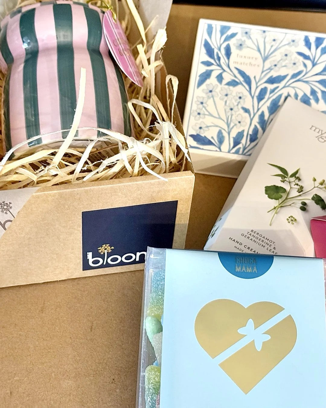 A Main St Blooms gift box packed with candles, chocolate and gifts