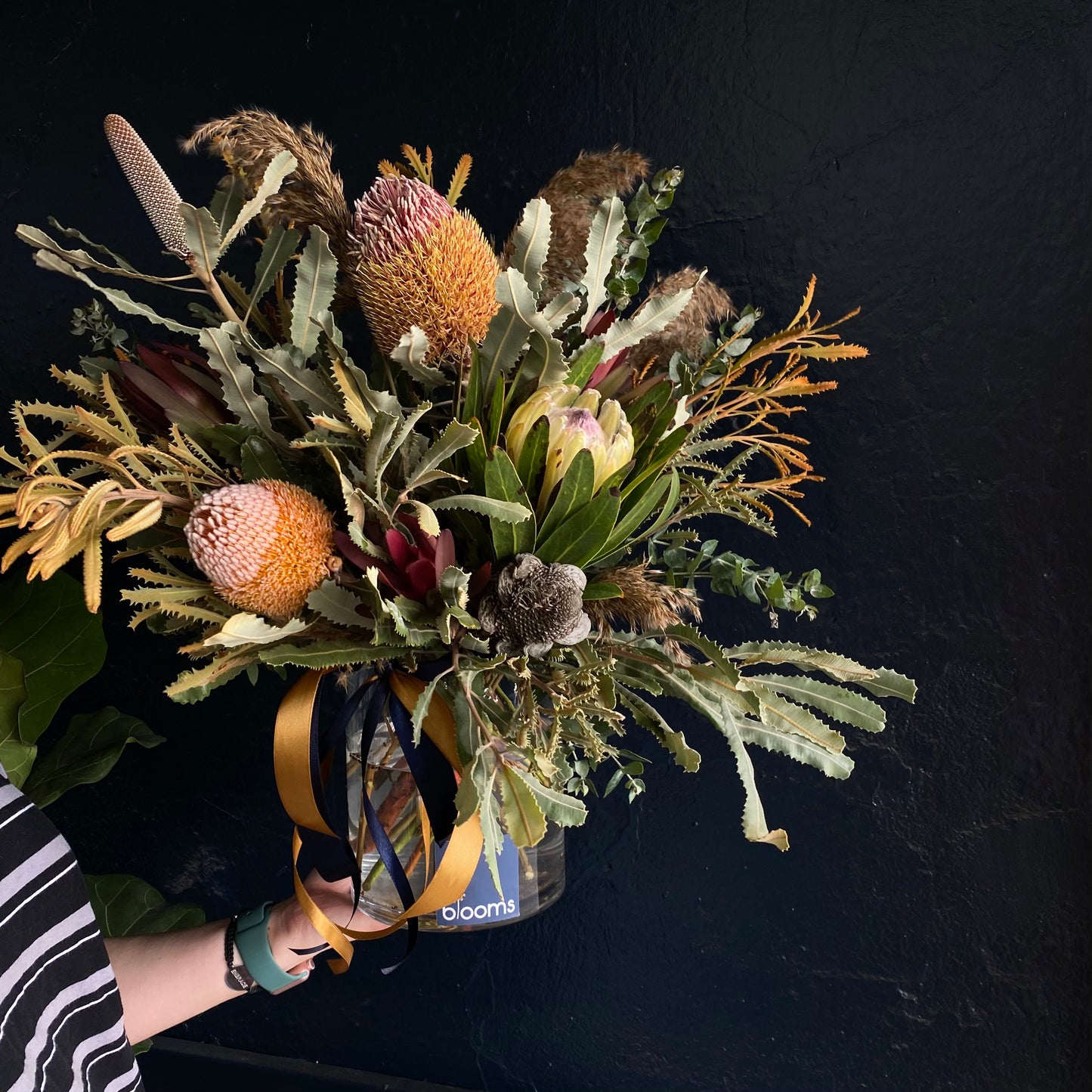 Luxury arrangement of native flower in a glass vase for delivery in the Clare Valley. Blooms include varieties of banksia's and protea's, leucadendrons with complimenting foliage.